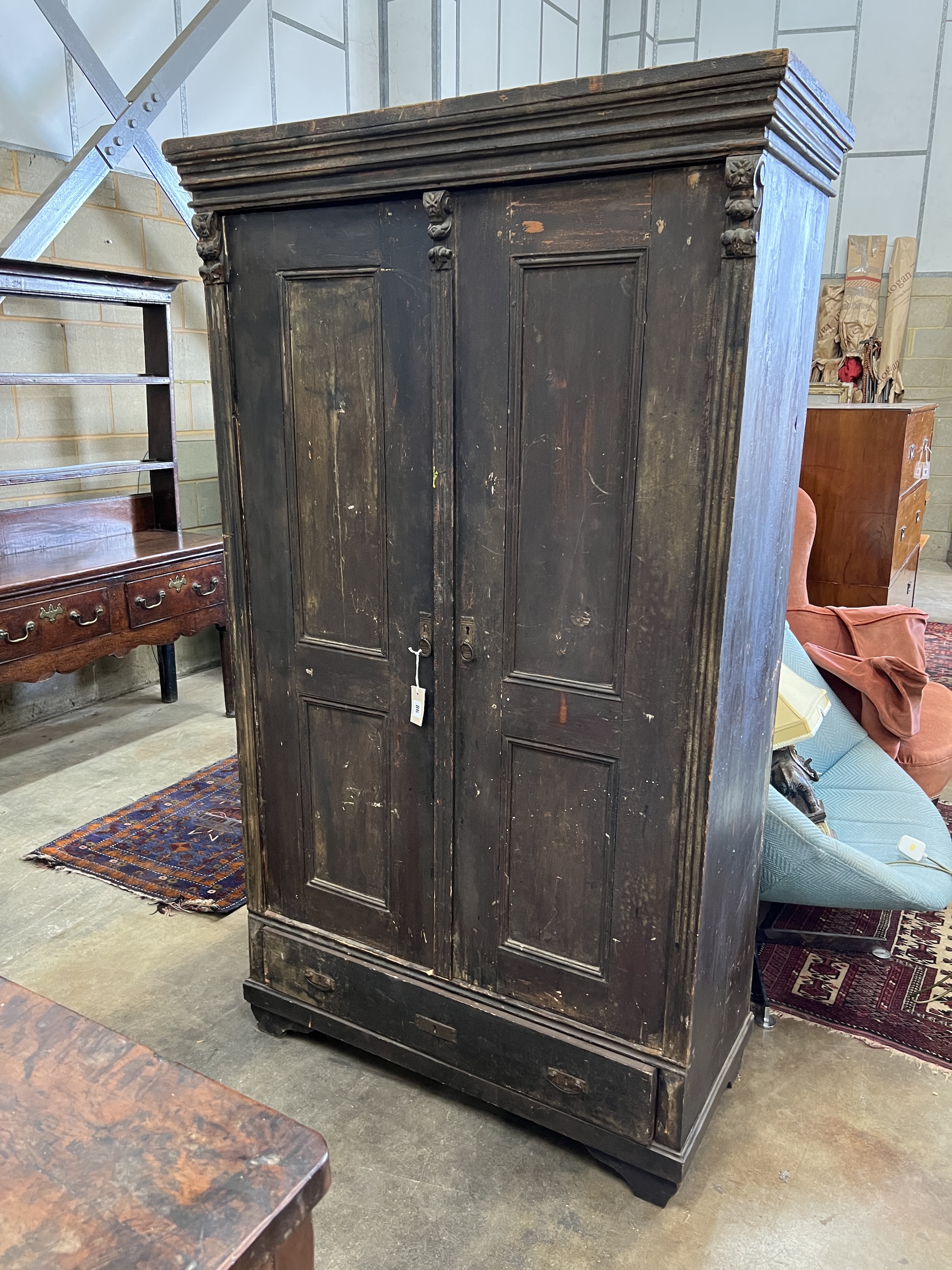 A 19th century East European stained pine household cupboard, width 105cm, depth 50cm, height 182cm
